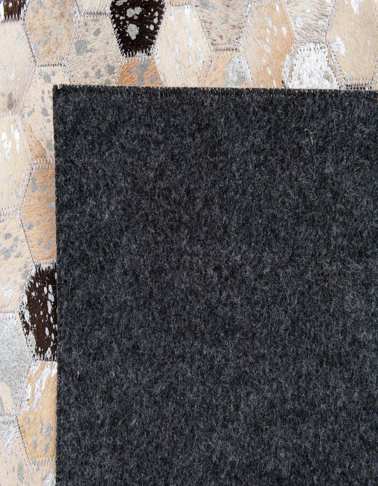 Detail image of  5' 3 x 7' 6 Cowhide Stocks Rug