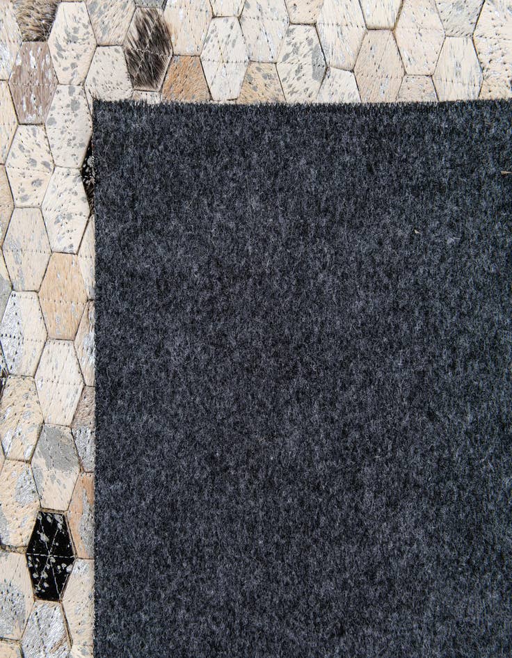 Detail image of  5' 3 x 7' 8 Cowhide Stocks Rug