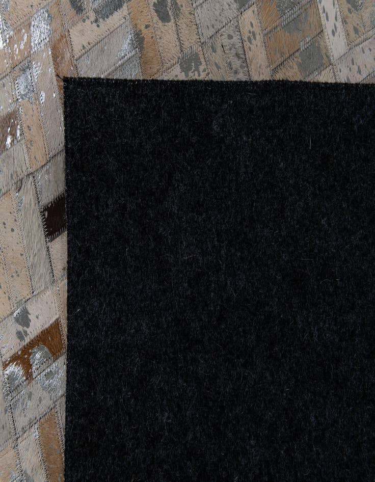 Detail image of  4' 11 x 8' 1 Cowhide Stocks Rug