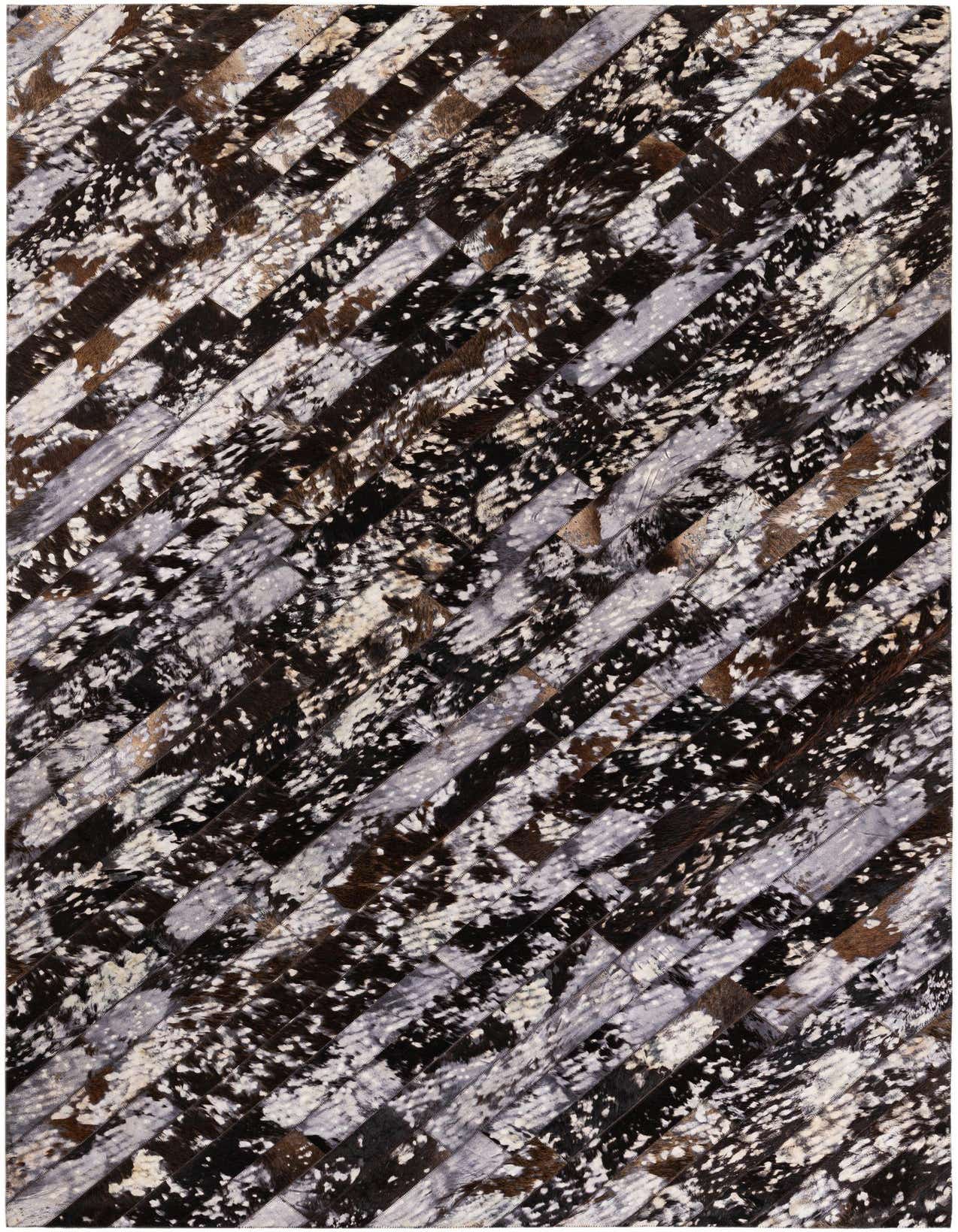 A rectangular 5x8 modern cowhide rug featuring diagonal stripes of black, white, brown, and gray patches.