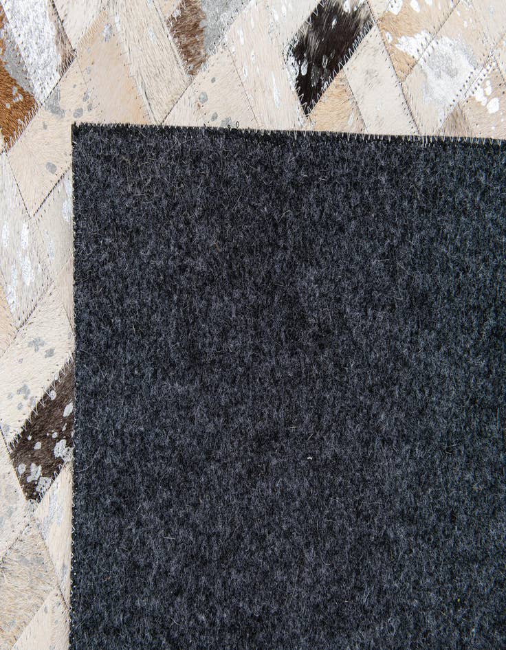 Detail image of  5' 4 x 7' 6 Cowhide Stocks Rug