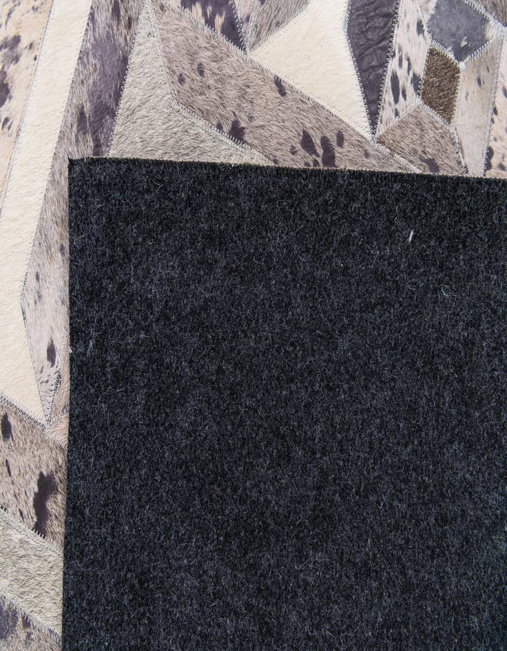 Detail image of  5' 2 x 8' 1 Cowhide Stocks Rug