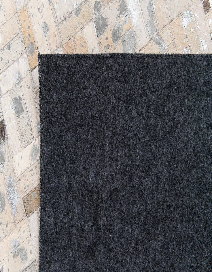 Detail image of  4' 11 x 8' 1 Cowhide Stocks Rug