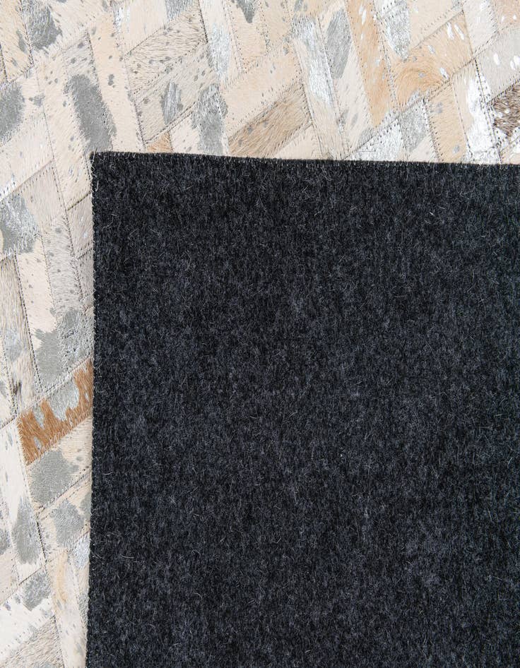 Detail image of  4' 11 x 8' 1 Cowhide Stocks Rug