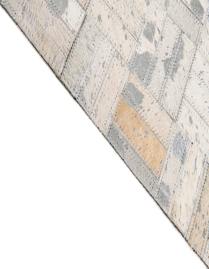Detail image of  4' 11 x 8' 1 Cowhide Stocks Rug