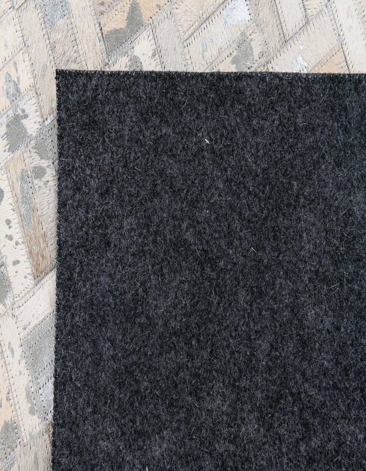Detail image of  4' 11 x 8' 1 Cowhide Stocks Rug