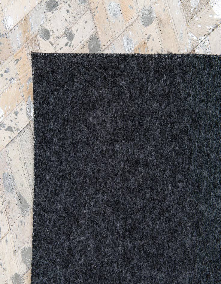 Detail image of  4' 11 x 8' 1 Cowhide Stocks Rug