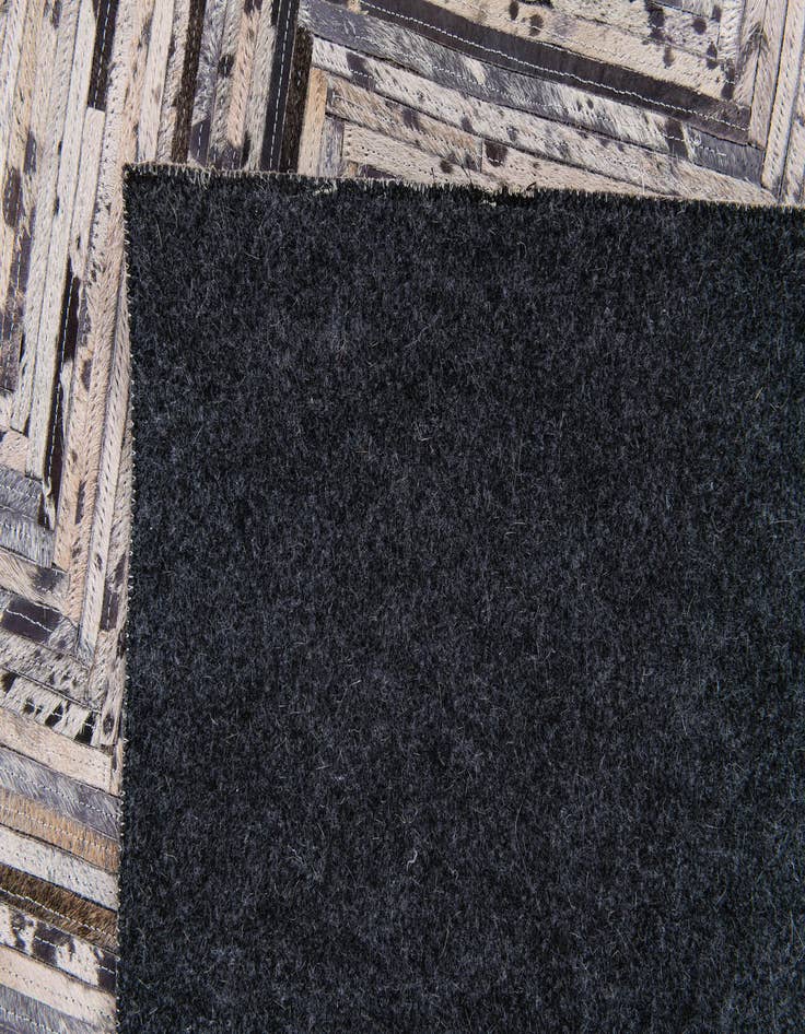 Detail image of  4' 11 x 8' 1 Cowhide Stocks Rug