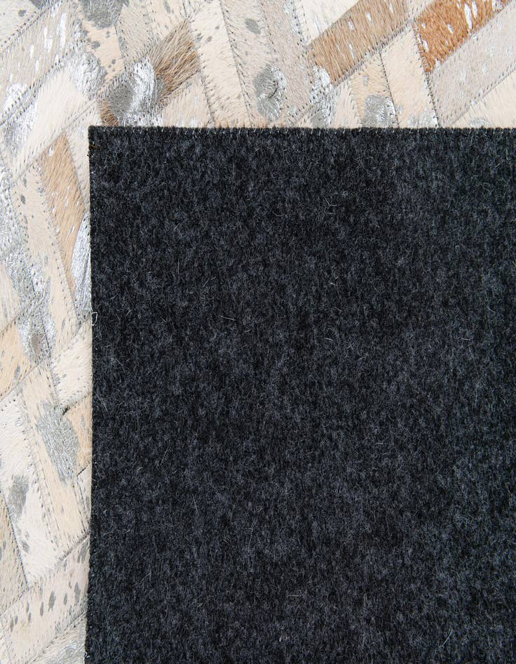 Detail image of  4' 11 x 8' 1 Cowhide Stocks Rug