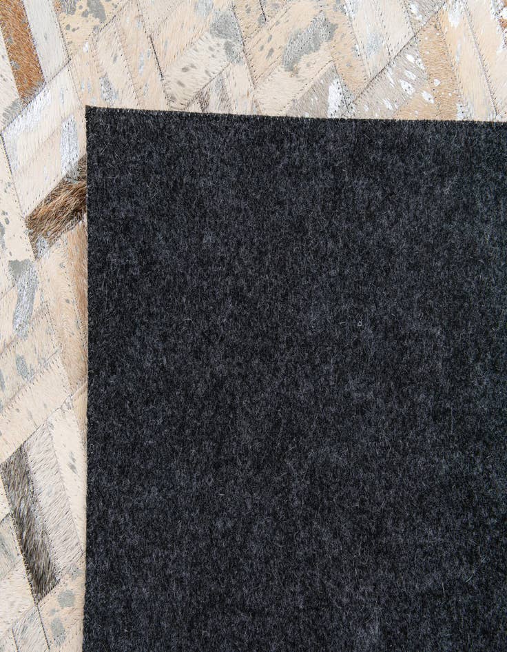 Detail image of  4' 11 x 8' 1 Cowhide Stocks Rug