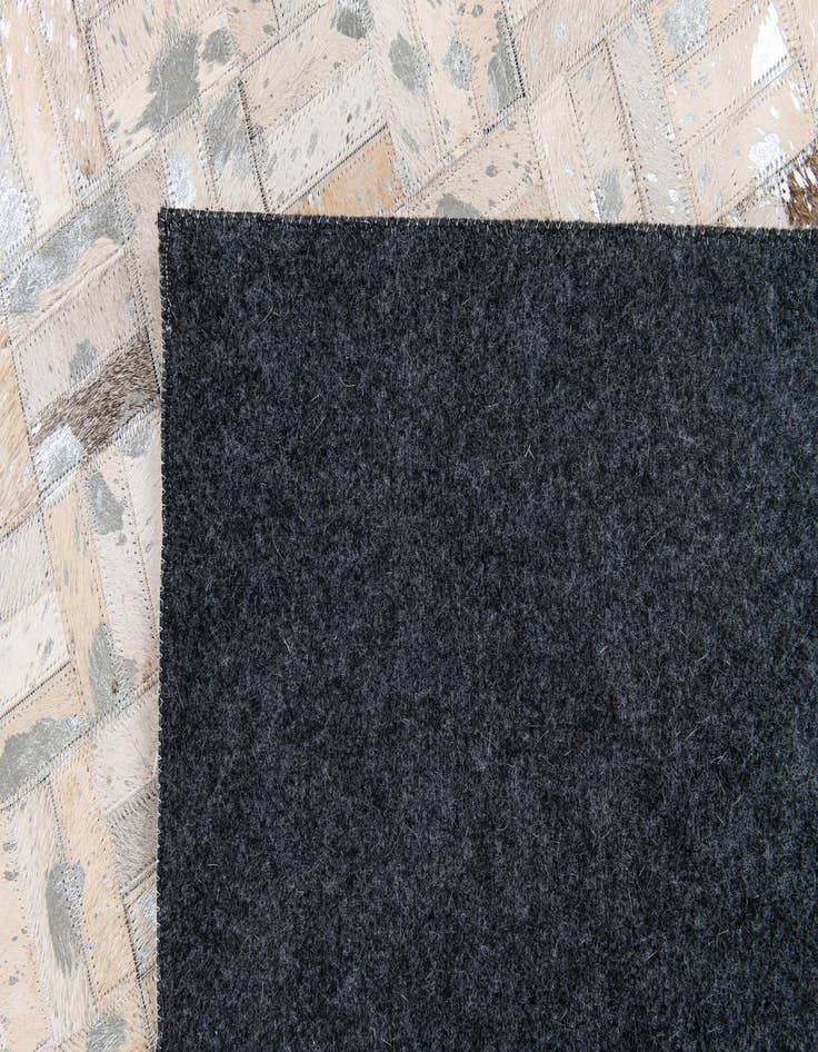 Detail image of  4' 11 x 8' 1 Cowhide Stocks Rug