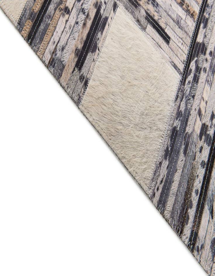Detail image of  4' 11 x 7' 8 Cowhide Stocks Rug