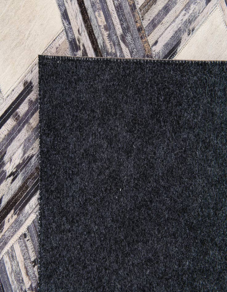 Detail image of  4' 11 x 7' 8 Cowhide Stocks Rug