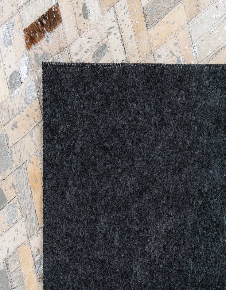 Detail image of  4' 11 x 8' 1 Cowhide Stocks Rug