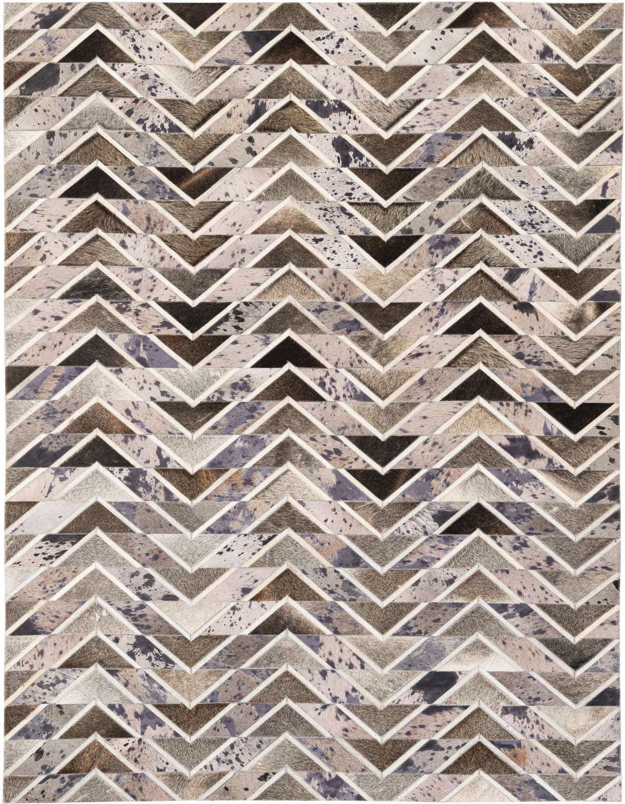 A 5x8 rectangular Cowhide Stocks rug featuring a modern chevron pattern in multi-colored natural cowhide and leather.