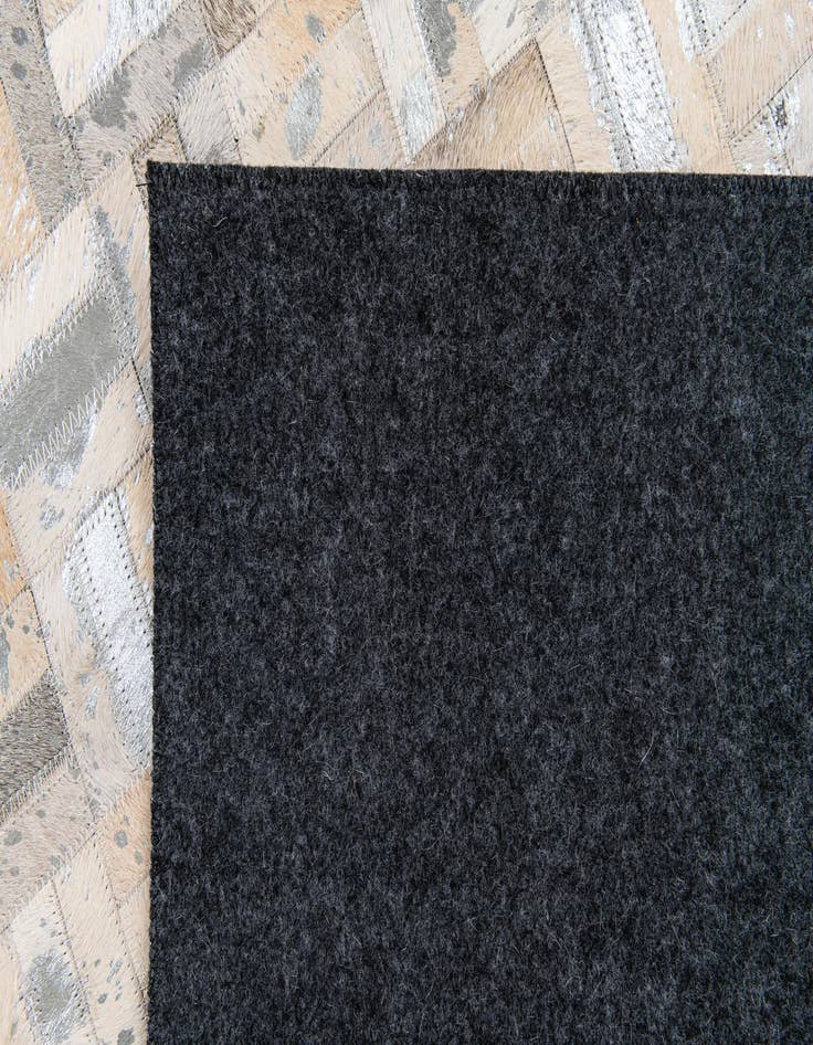 Detail image of  4' 11 x 8' 1 Cowhide Stocks Rug