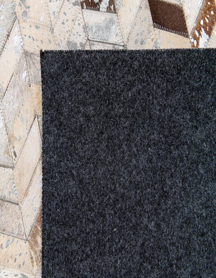 Detail image of  5' 3 x 7' 6 Cowhide Stocks Rug