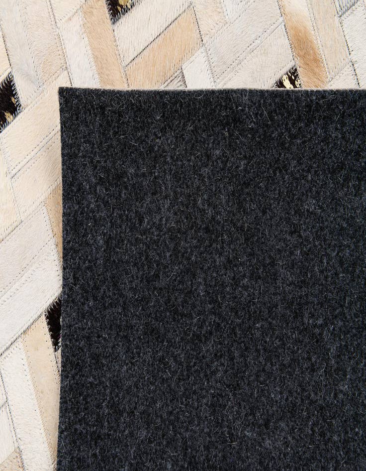 Detail image of  5' 1 x 8' Cowhide Stocks Rug