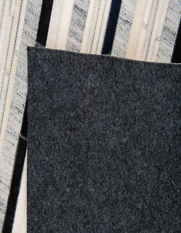 Detail image of  5' 1 x 7' 10 Cowhide Stocks Rug