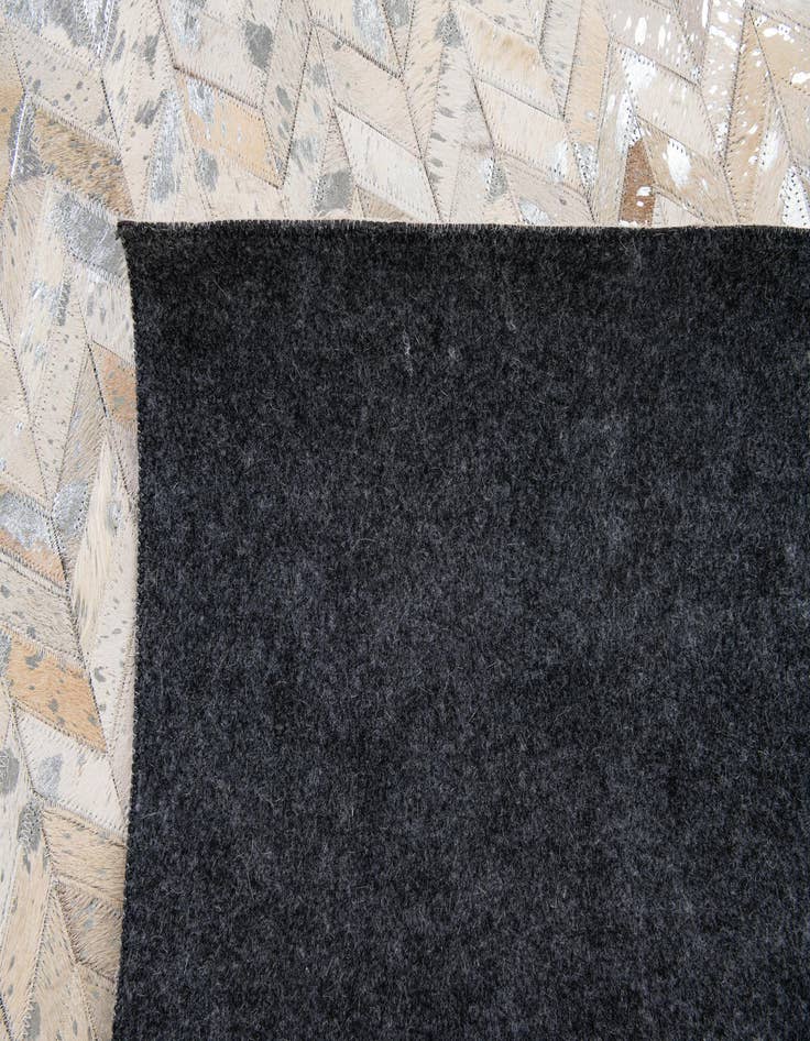 Detail image of  5' 1 x 8' Cowhide Stocks Rug