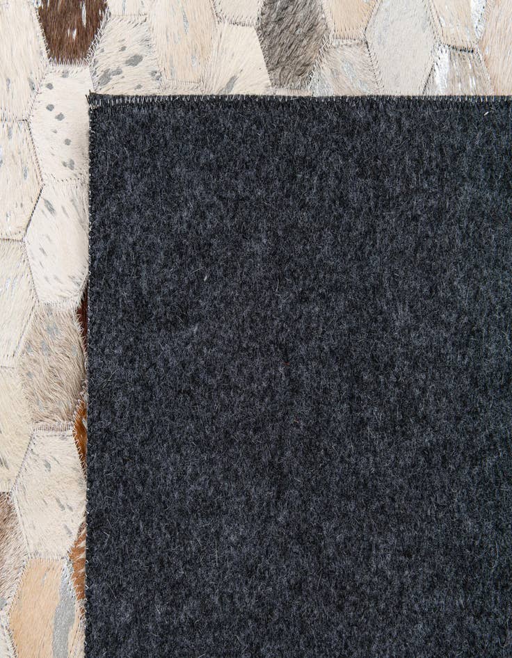 Detail image of  5' x 7' 11 Cowhide Stocks Rug