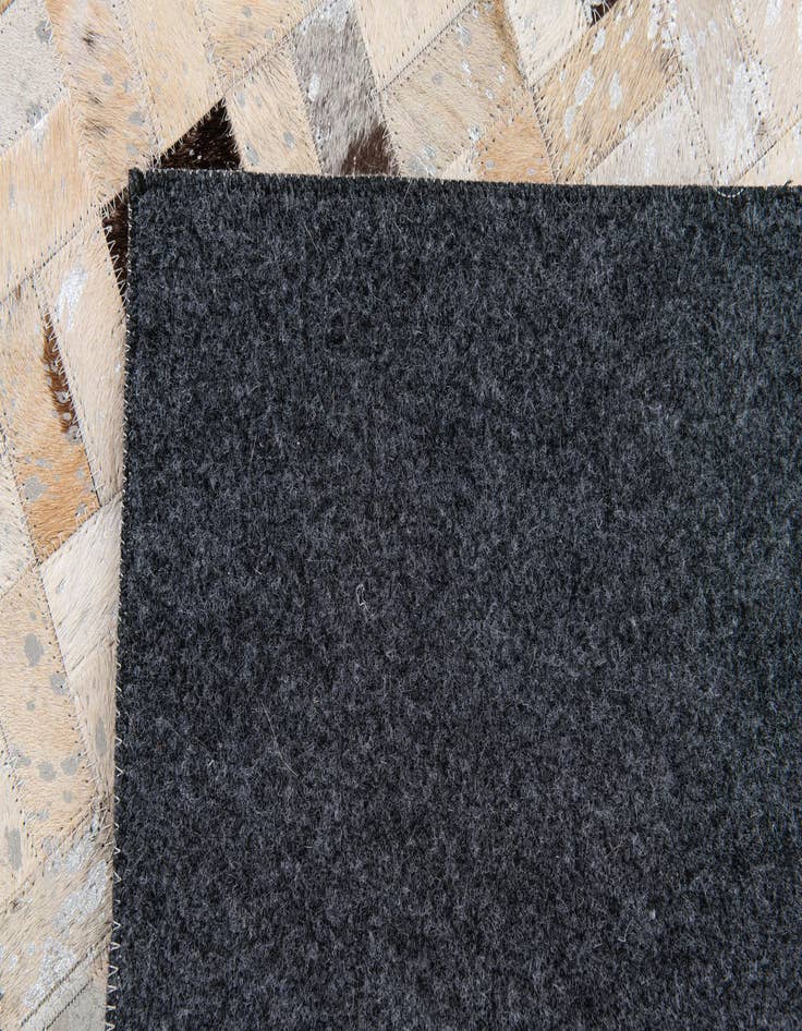 Detail image of  5' 3 x 7' 3 Cowhide Stocks Rug