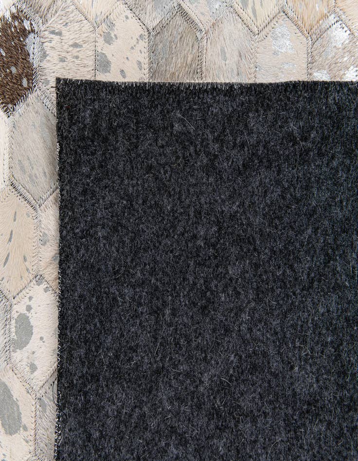 Detail image of  5' 1 x 8' Cowhide Stocks Rug