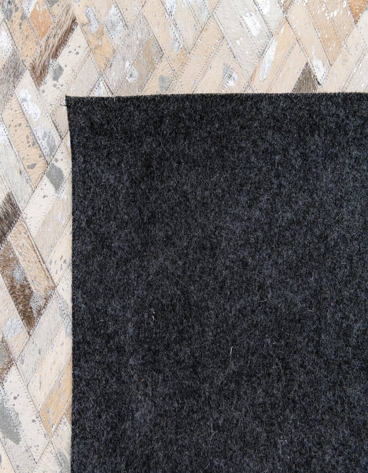 Detail image of  4' 11 x 7' 10 Cowhide Stocks Rug