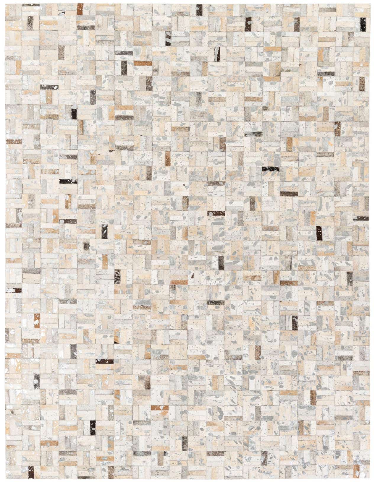 A rectangular 5x8 modern multi-colored cowhide rug with a patchwork pattern of various natural hide tones.