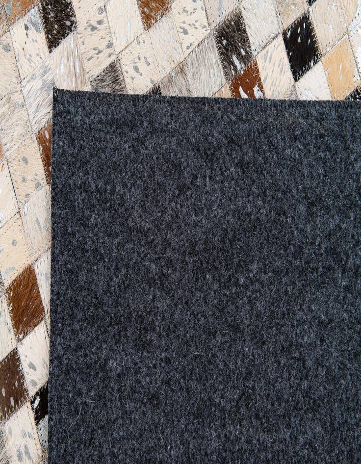 Detail image of  5' 3 x 7' 6 Cowhide Stocks Rug