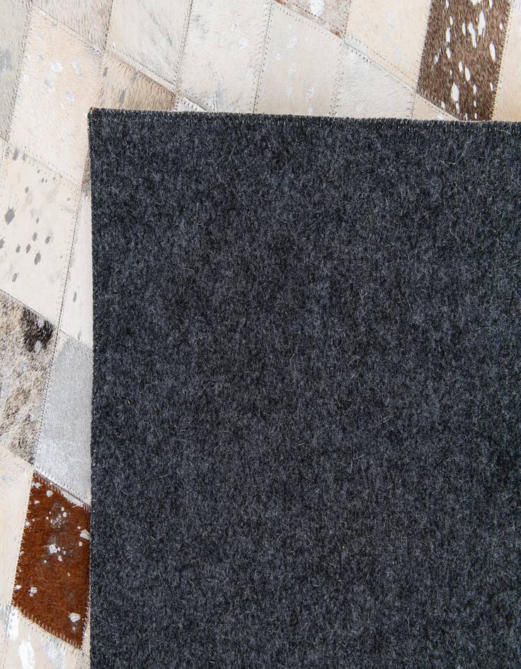 Detail image of  7' 11 x 9' 11 Cowhide Stocks Rug