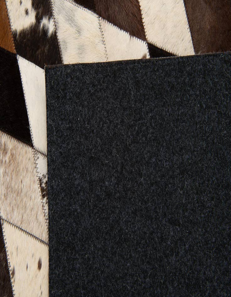 Detail image of  5' 7 x 8' Cowhide Stocks Rug