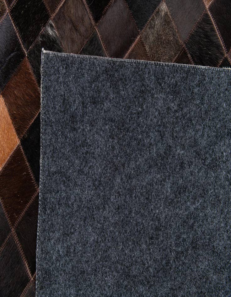 Detail image of  5' x 7' 9 Cowhide Stocks Rug