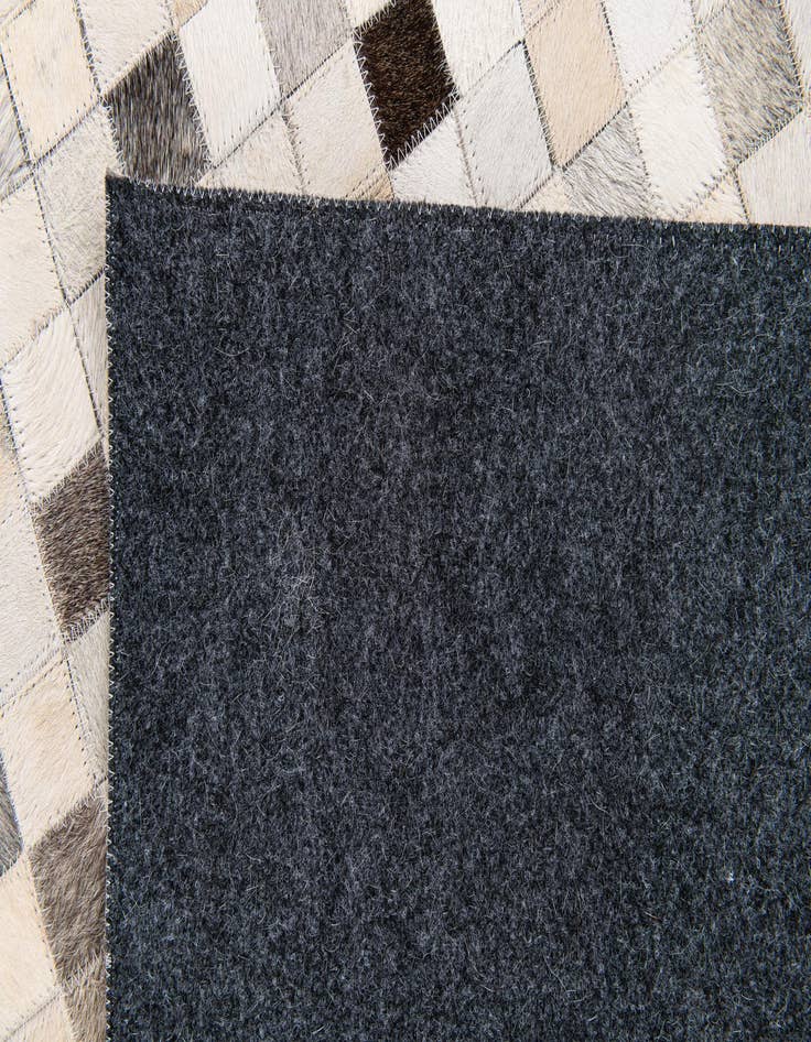 Detail image of  5' x 7' 11 Cowhide Stocks Rug