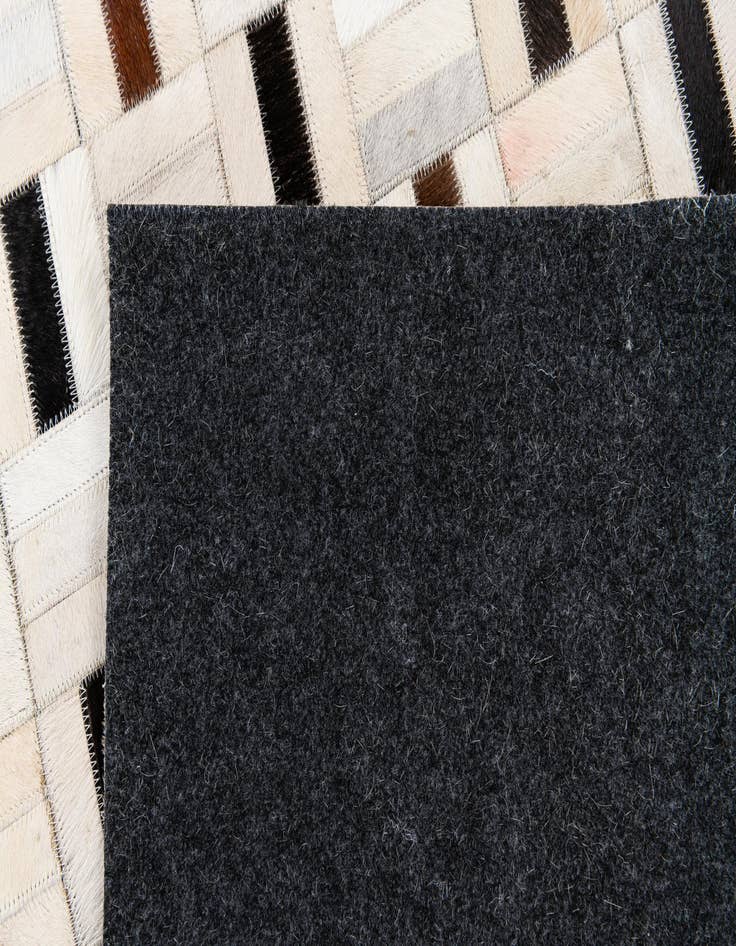 Detail image of  5' 1 x 8' Cowhide Stocks Rug