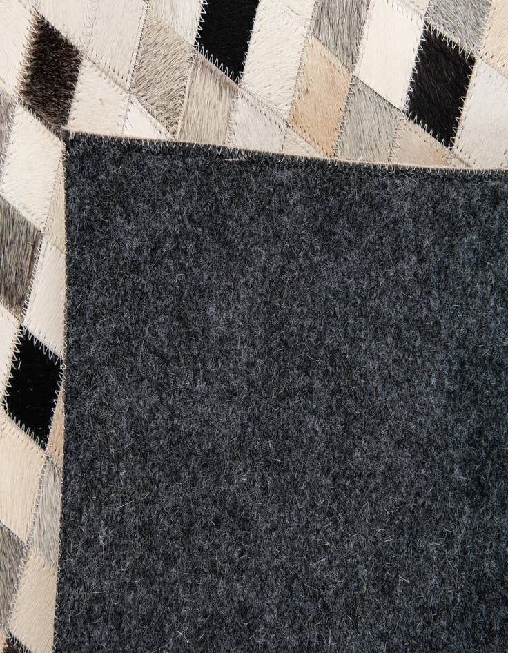 Detail image of  5' 1 x 8' Cowhide Stocks Rug