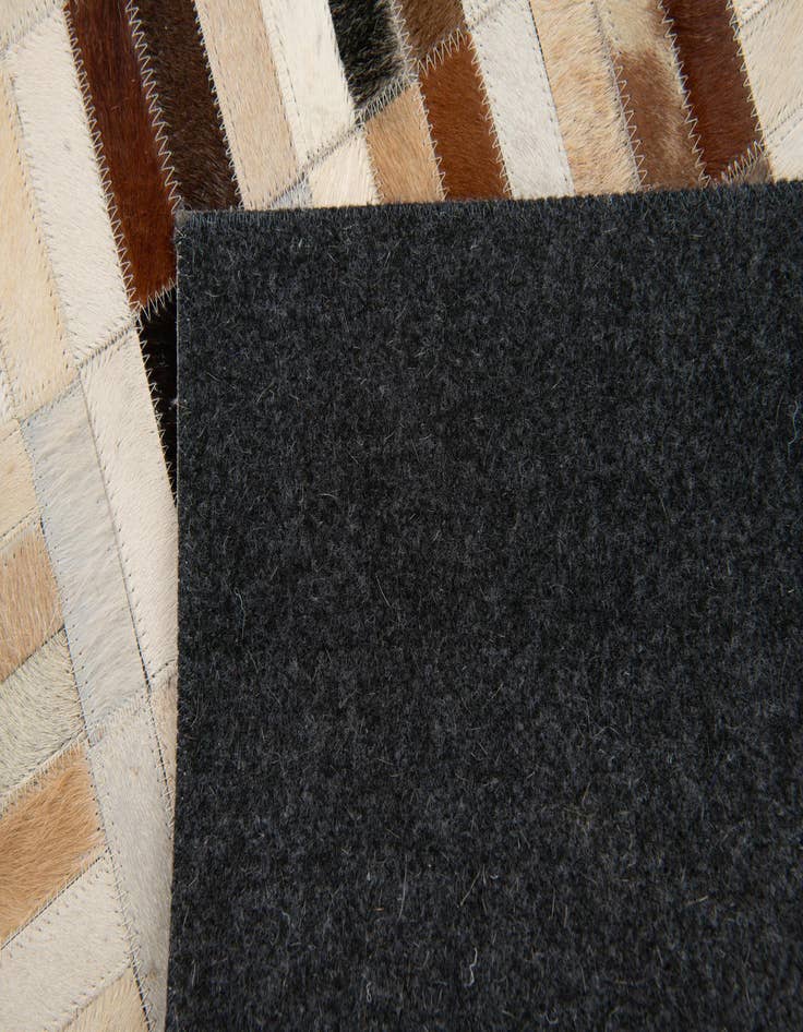 Detail image of  5' x 7' 11 Cowhide Stocks Rug