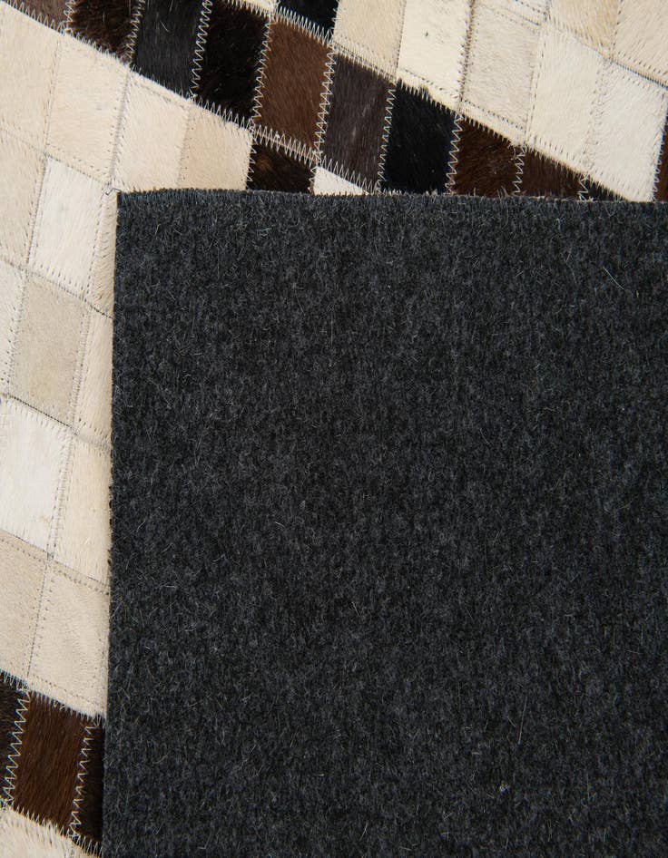 Detail image of  5' 2 x 8' Cowhide Stocks Rug