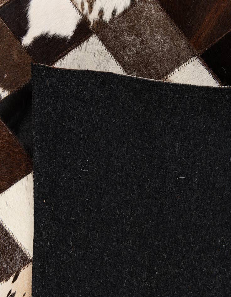 Detail image of  5' 2 x 8' 1 Cowhide Stocks Rug