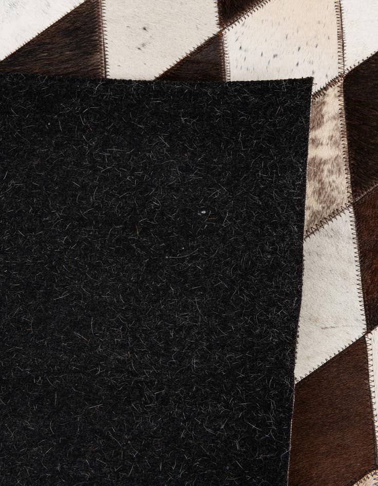 Detail image of  5' 2 x 8' 1 Cowhide Stocks Rug