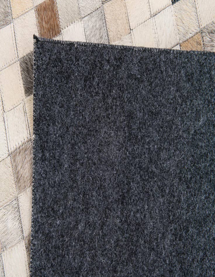 Detail image of  5' x 7' 11 Cowhide Stocks Rug