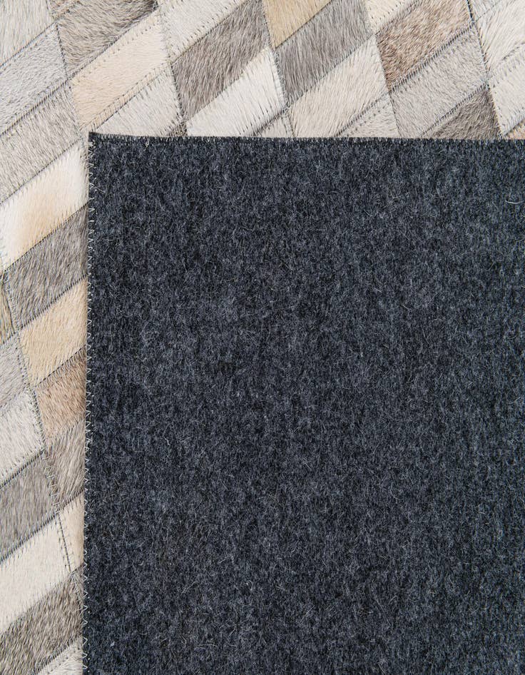 Detail image of  5' 3 x 8' Cowhide Stocks Rug
