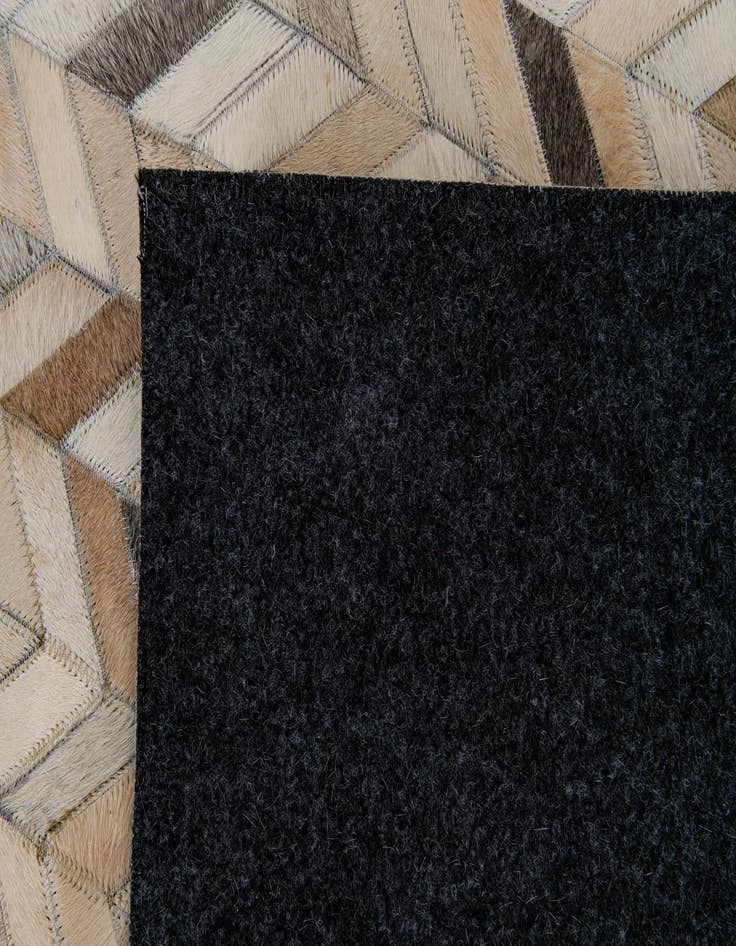 Detail image of  6' 8 x 9' 11 Cowhide Stocks Rug