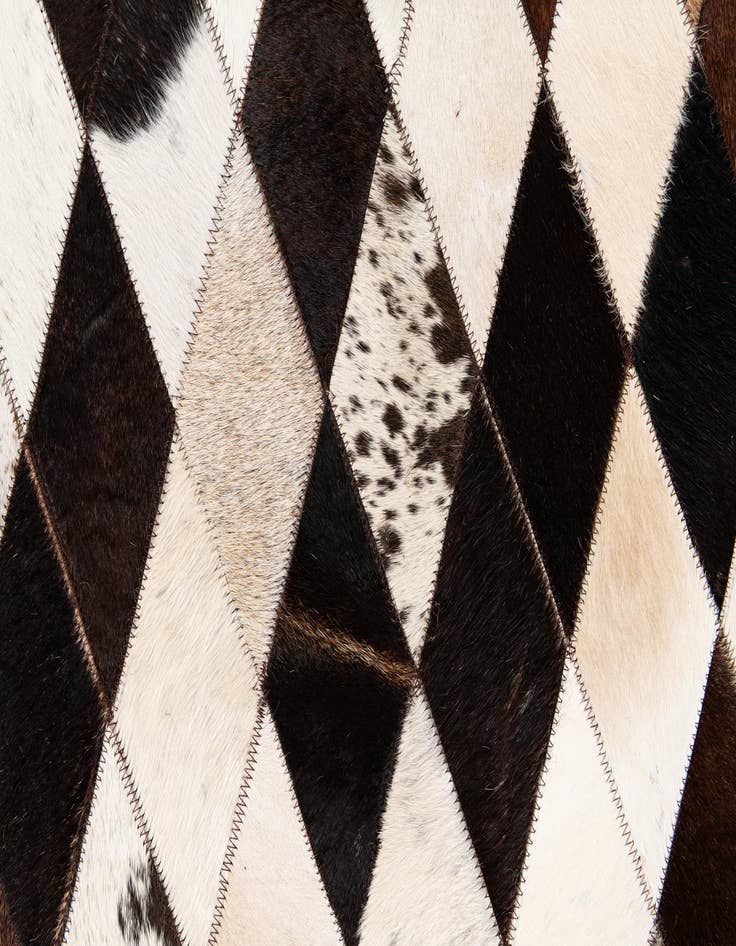 Detail image of  6' 7 x 9' 10 Cowhide Stocks Rug