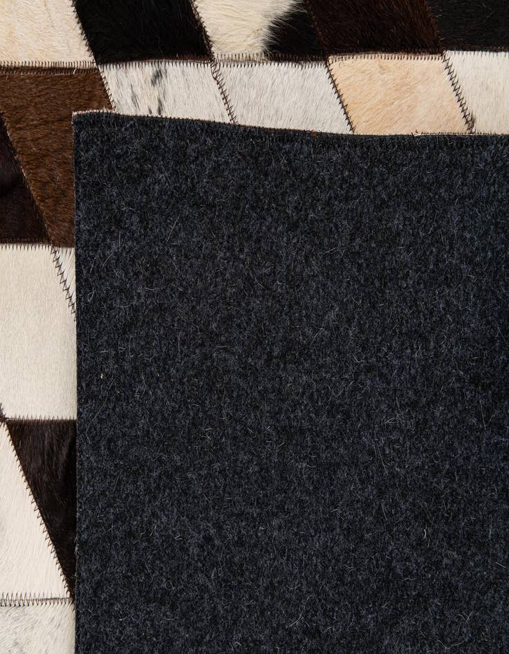 Detail image of  6' 7 x 9' 10 Cowhide Stocks Rug