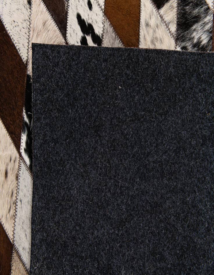 Detail image of  6' 7 x 9' 10 Cowhide Stocks Rug