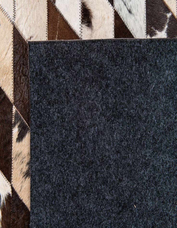 Detail image of  6' 9 x 9' 11 Cowhide Stocks Rug