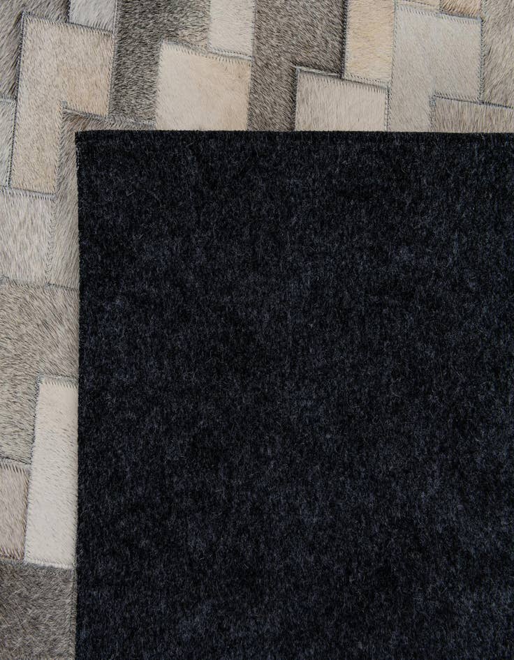 Detail image of  6' 7 x 9' 10 Cowhide Stocks Rug