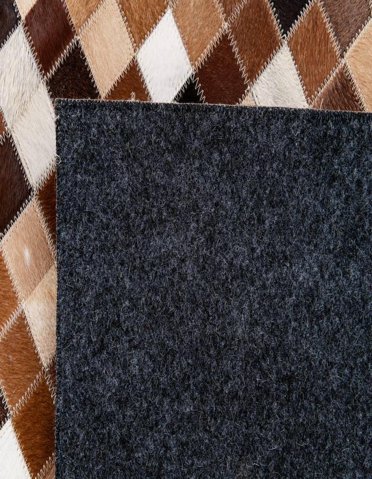 Detail image of  6' 8 x 9' 10 Cowhide Stocks Rug