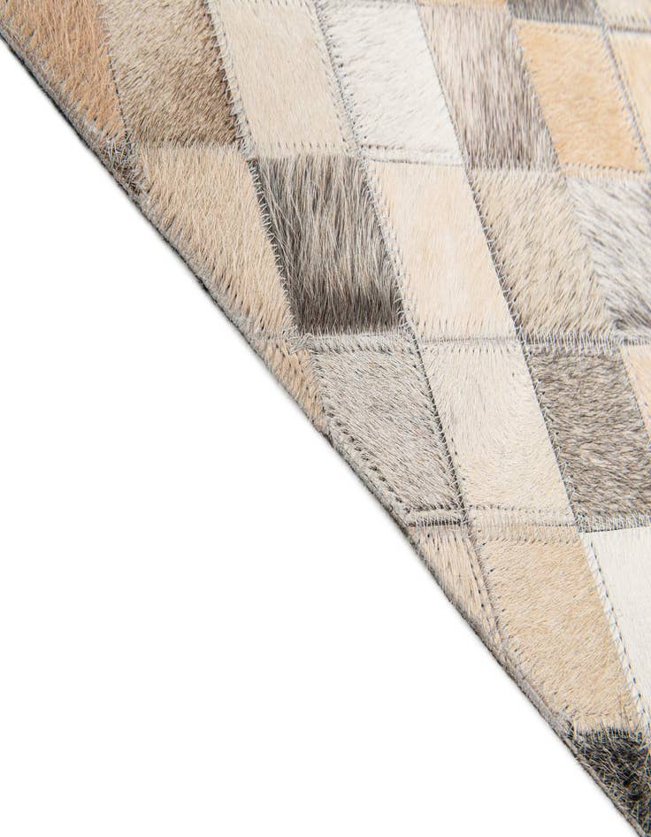 Detail image of  6' 7 x 9' 11 Cowhide Stocks Rug